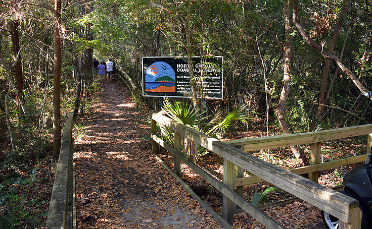 A sign marks an entrance to Bald Head Woods, NC